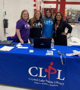 Library staff at table located at an elementary school